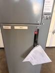 Lower door of the motor control center unit with disconnect handle and a paper schematic hanging from it