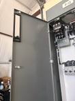Motor control center door swung open to show the starter and motor circuit protectors inside, labeled P-13