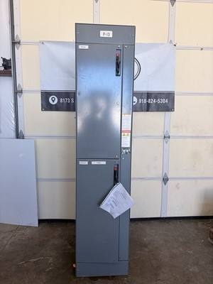Gray two-section Allen-Bradley Bulletin 2100 motor control center cabinet, doors closed, labeled P-13