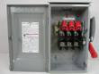 Siemens fusible safety switch with door open: three red fuse holders, red handle and wiring label