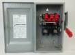 Siemens safety switch with door open showing red fuse blocks, terminals, red handle and label inside the door
