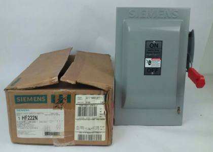 Siemens HF222N safety switch beside its worn shipping carton, with ON/OFF door plate and red handle