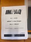 IMPAQ EI1/EI3 battery charger owner's manual cover page on top of the packaging