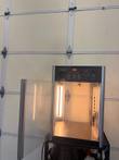 Hatco Flav-R-Fresh display cabinet with glass door swung open, lit interior and control panel