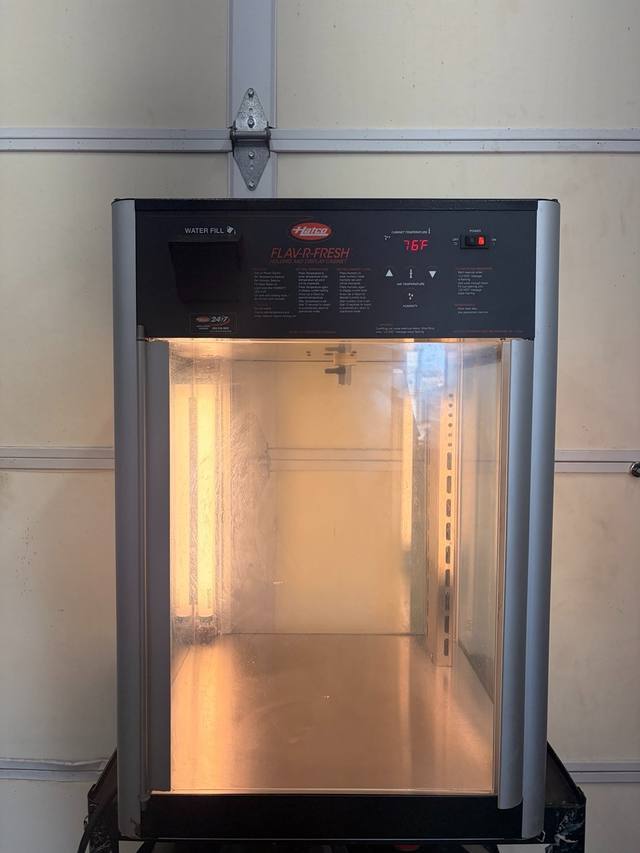 Hatco Flav-R-Fresh heated display cabinet, front view with glass door closed and empty interior