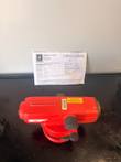 Red SECO automatic level on a black tray with its Whitlock Instrument certificate of calibration behind it