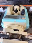Top view of a Leica LDT-05 theodolite in its foam-lined orange case, showing the display, keypad and tribrach