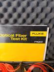Fluke Optical Fiber Test Kit FTK200 manual cover resting against the case lid foam
