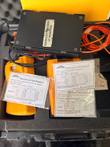 Fluke FTK200 case with two orange Fluke units, black module, fiber cords and three patchcord test reports