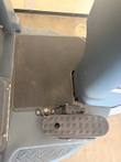 Operator platform of the Nilfisk Liberty SC60 with textured floor mat and a rubber foot pedal