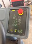 Nilfisk Liberty SC60 control panel with red emergency stop, plus and minus buttons, horn and brush keys