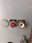 ON pilot lamp and HAND-OFF-AUTO selector switch on the enclosure door