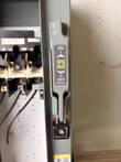 Square D disconnect handle in the ON/OFF (RESET) position with lockout clip