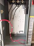 Inside the Square D enclosure: backplate, wiring and grounding terminal