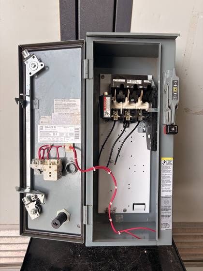 Square D starter enclosure with door open, 30A disconnect, red wiring and nameplate
