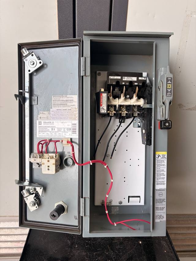 Square D starter enclosure with door open, 30A disconnect, red wiring and nameplate