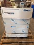 Follett refrigerator front with digital temperature controls and lock, protective film on the door