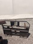Pallet fork carriage with MW logo cutout backrest and quick-attach plates, one tine showing