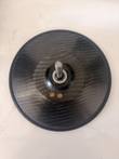 Underside of a carbon fiber rotor with woven pattern, center spindle and two orange balancing plugs