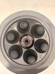 Rotor with lid off showing six round sample wells numbered 1 to 6 around the center hub plate