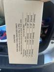 Cardboard box printed with a poke-thru device caution table of core bit sizes for 2, 3 and 4 inch holes
