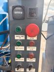 Cramer hour meter, timer, red emergency stop and labeled control buttons on the control box