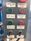 Control panel buttons: control power, emergency stop, shot blast, dust collector, door and eject switches