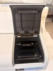 Open plate chamber door on the Victor X Light reader showing the black plate carrier inside