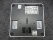 Underside of the Enterasys access point with gray base, rubber feet, keyhole mounting slots, labels and ports