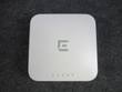 Top of the white square Enterasys access point with gray E logo and LED row