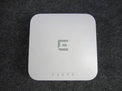 Top of the white square Enterasys access point with gray E logo and LED row