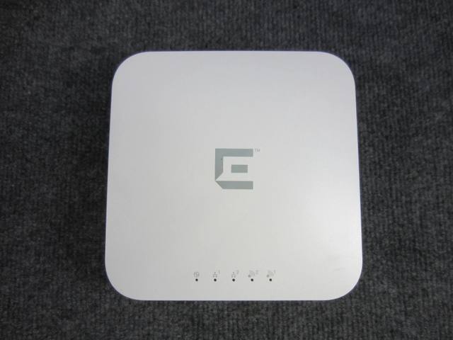 Top of the white square Enterasys access point with gray E logo and LED row