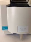 Single Cell Module housing with its label and a white lever on the Beckman spectrophotometer
