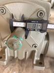 Digital caliper measuring the output shaft of the gear reducer