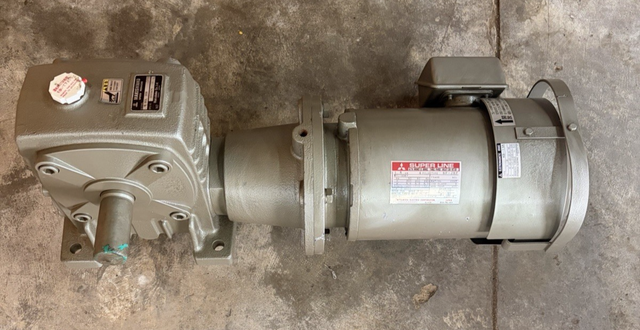 Mitsubishi Super Line brake motor bolted to a gray worm-gear reducer, shaft at left, red nameplate