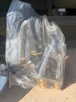 Williams ARFF nozzle sealed in a clear plastic bag with brass quick couplers at the bottom