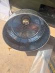 Round galvanized steel pan with wire mesh screen inside, seen from above