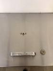 Stainless lid panel with True chrome handle, key lock and small latch on the milk cooler