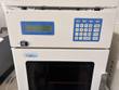 Jasco AS-2059 Plus intelligent sampler with LCD, keypad and tinted window, a controller module above