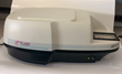 BioTek FL600 microplate fluorescence reader, cream cover on black base, plate carrier at right
