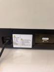 BioTek FL600 rear panel with mains power inlet, voltage and fuse label and a serial port