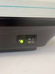 Green power light and ON/OFF rocker switch on the black base of the BioTek FL600 reader