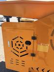 Orange access door with a hexagon vent pattern and a Watch Out warning label on the crusher side