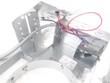 Inside of a recessed light housing showing wiring in the junction box, flex conduit and adjustable brackets