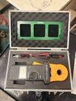 Extech clamp-on ground resistance tester open in its hard case with test leads and green verification plate