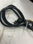 Black power cord with plug and connector, coiled and tied with a cable tie