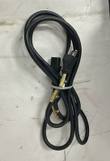 Coiled black power cord with three-prong plug and equipment connector, held with a cable tie