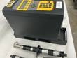 Black Stanley CELL-04 controller with yellow keypad and two pneumatic right-angle tools in front