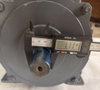 Motor shaft end with a digital caliper reading 1.11 inches across the shaft