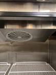 Refrigerator evaporator fan housing and top shelf, seen from a different angle